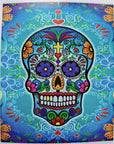 Colorful Day of the Dead sugar skull design on a blue background