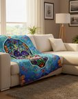 Colorful blanket draped over a beige sectional sofa in a living room.
