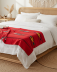 red Mexican fish design blanket in boho style bedroom