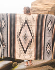 blanket being displayed at the beach