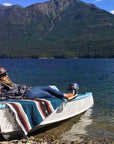 Relaxing beachside on boat with blue Mexican diamond blanket