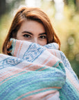 Woman wrapped in Mexican falsa blanket