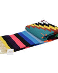 Colourful folded Mexican blanket for bedspread or picnic