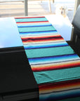 Green table runner - colour Mexican style on glass table