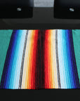 Striped design long table runner on black glass table
