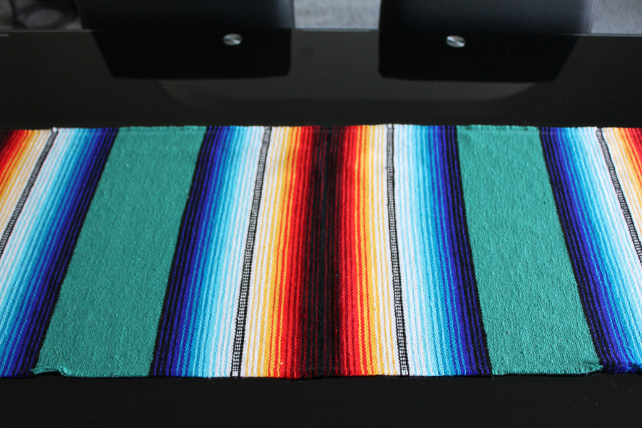 Striped design long table runner on black glass table