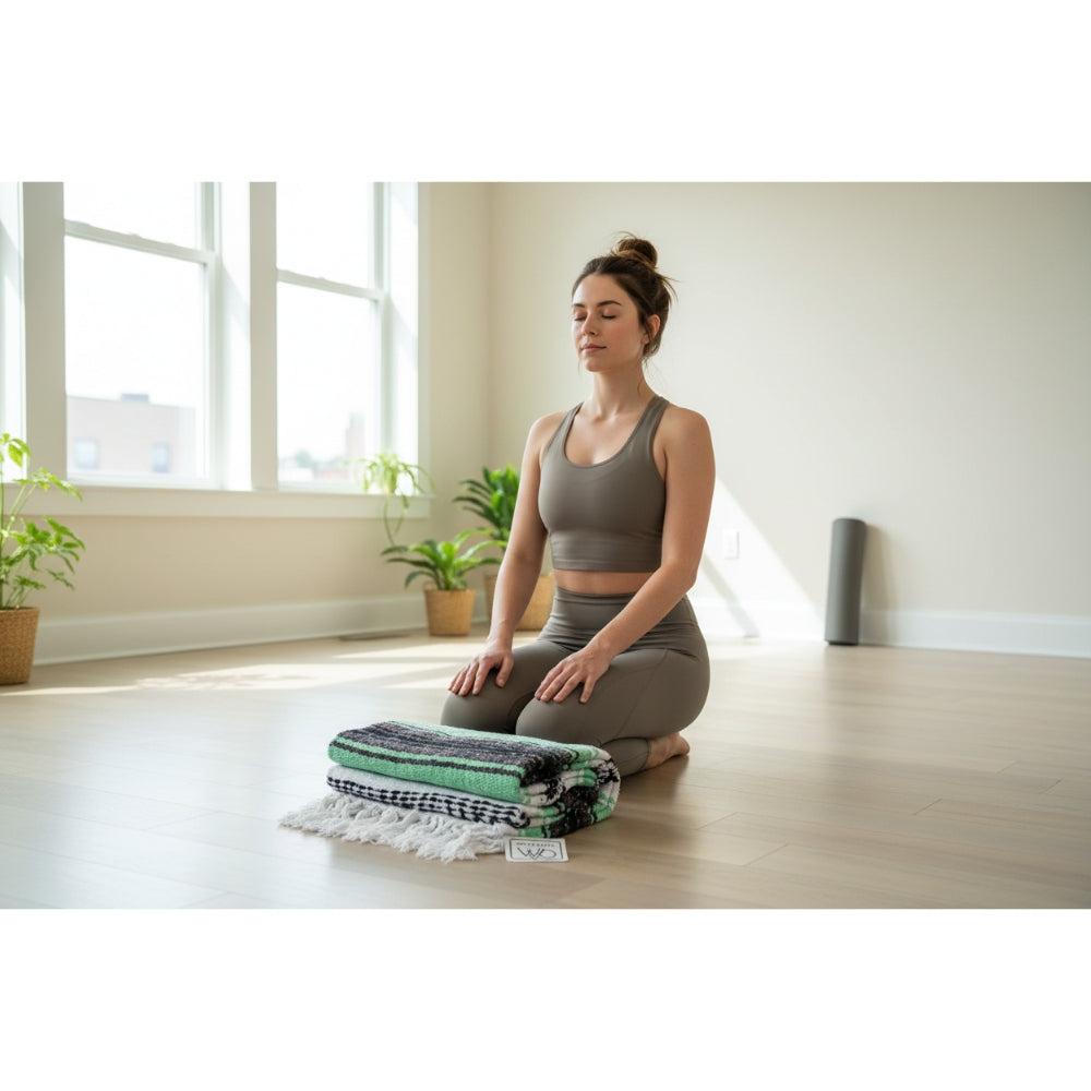 Woman in a yoga pose in a bright room with plants and a yoga mat.