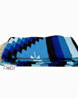 Folded Blue and White Mexican made blanket
