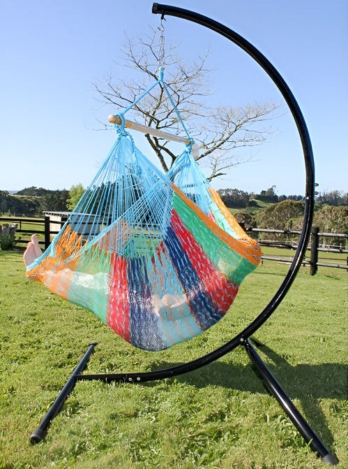 Colorful hammock on a stand with a scenic background