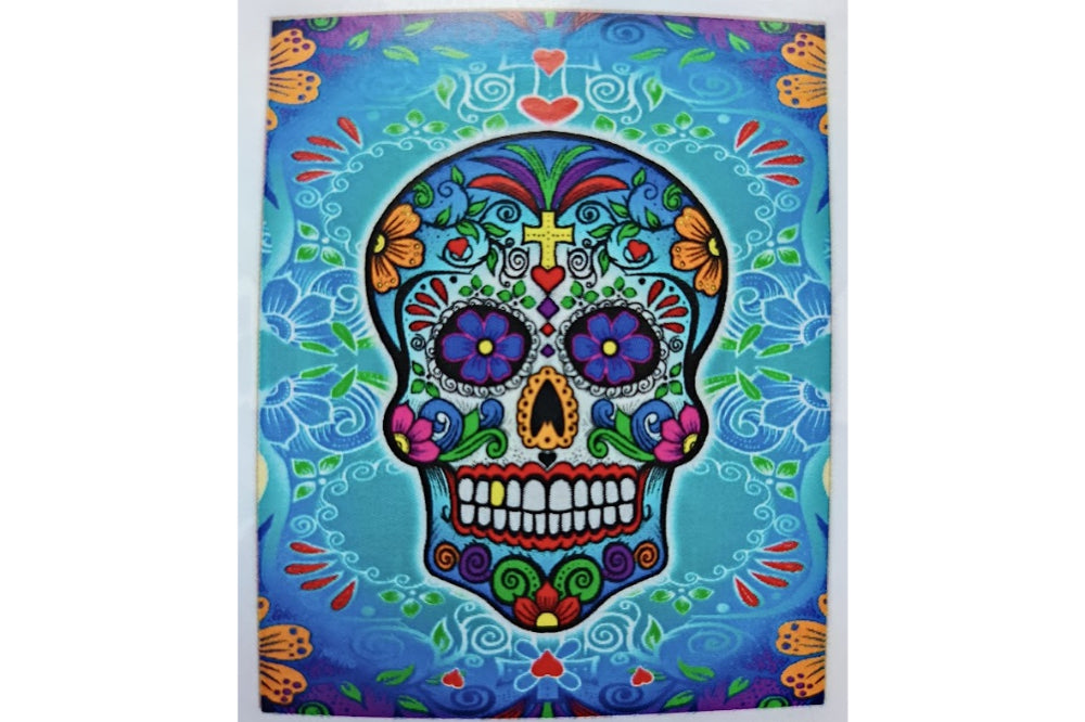 Colorful Day of the Dead sugar skull design on a blue background