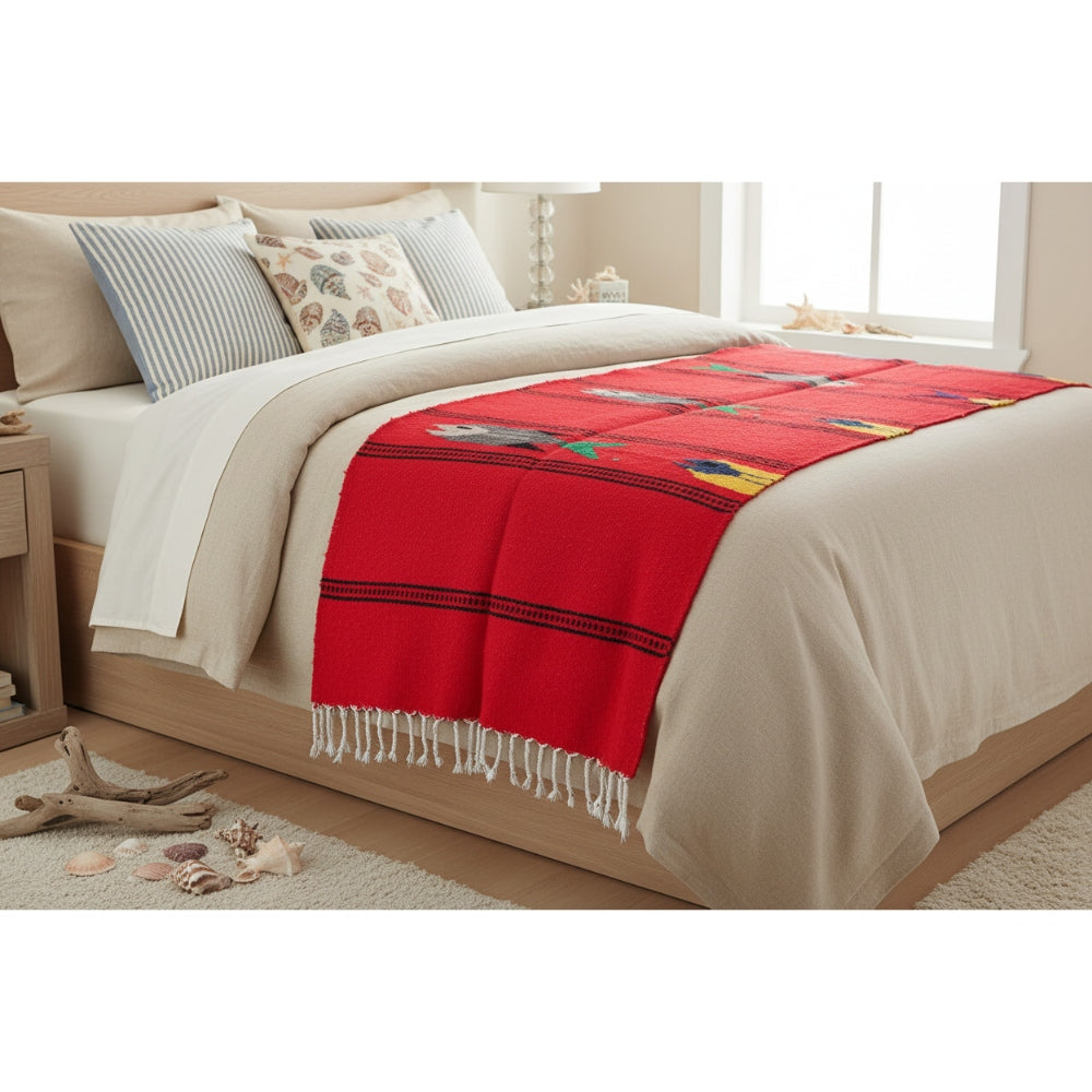 Bed with a red runner and white bedding in a bedroom setting