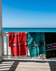 Three Fish Blankets on Beach Railing