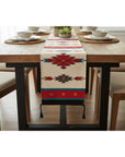 Dining table with a patterned table runner in a home setting