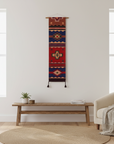 Decorative wall hanging with geometric pattern in a living room setting
