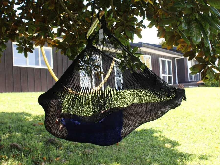 Women lying in XL size Mexican chair hammock