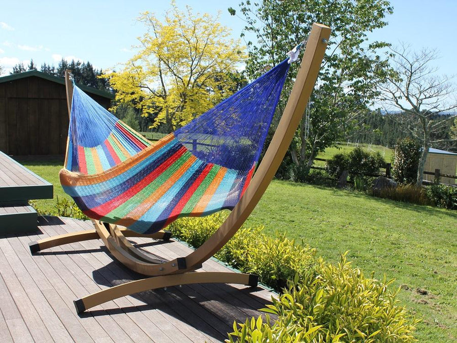 Rainbow coloured cotton hammock and free standing frame