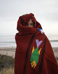 Women wrapped in Mexican blanket - fish design