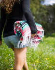 Woman hiking with Mexican rug