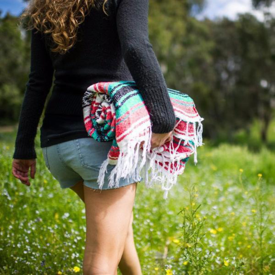 Woman hiking with Mexican rug