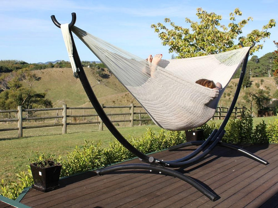 White cotton Mexican hammock and arc shaped hammock stand