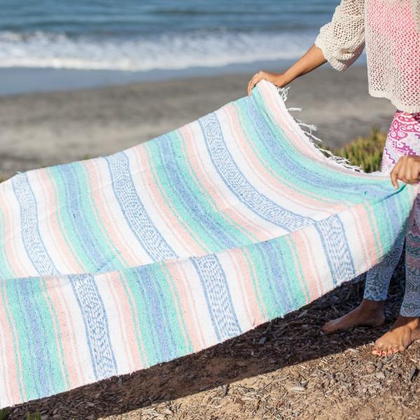 Light pastel toned Mexican falsa rug