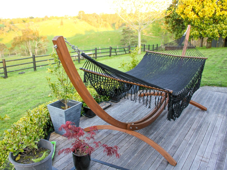 Black hammock on wooden frame